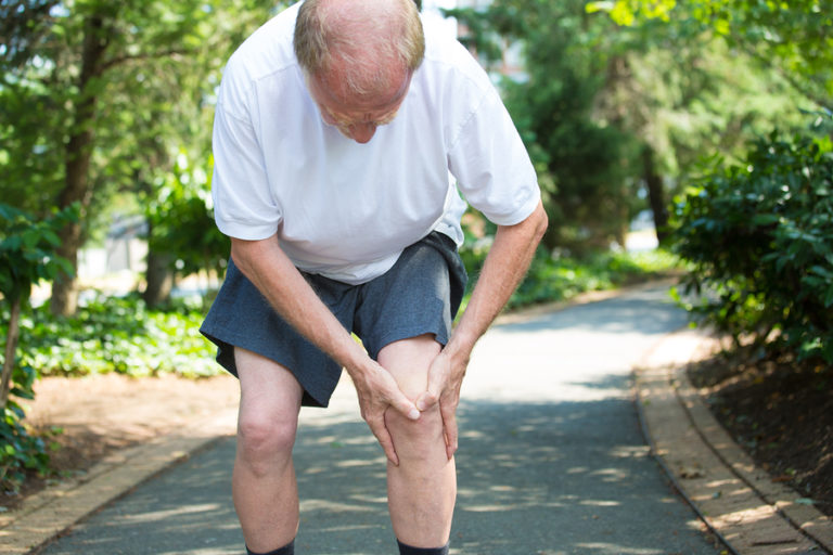 Senior man with pain in knee